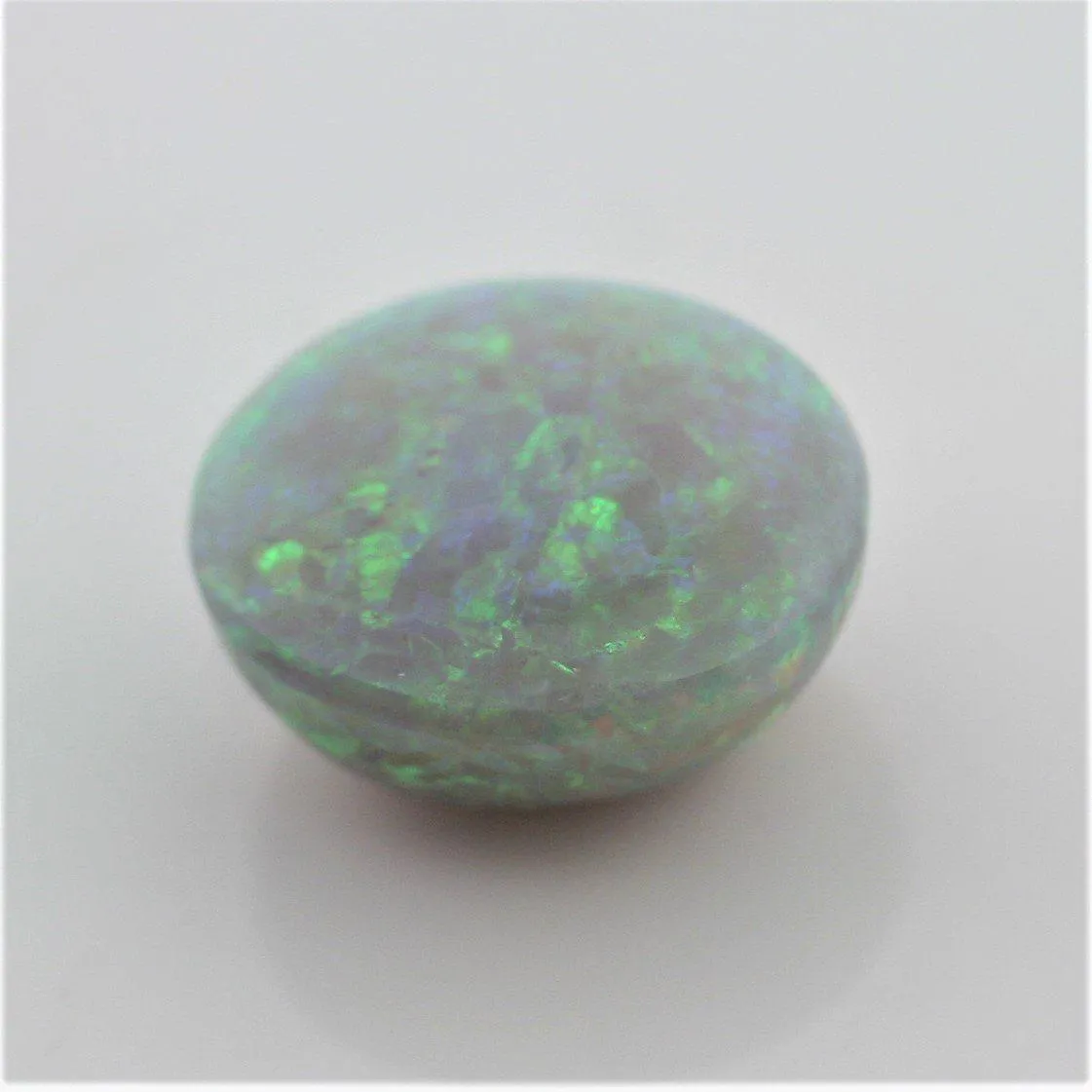 4.67 carat Australian Dark Opal Cabochon Play of Color Green-Orange Blue Tone