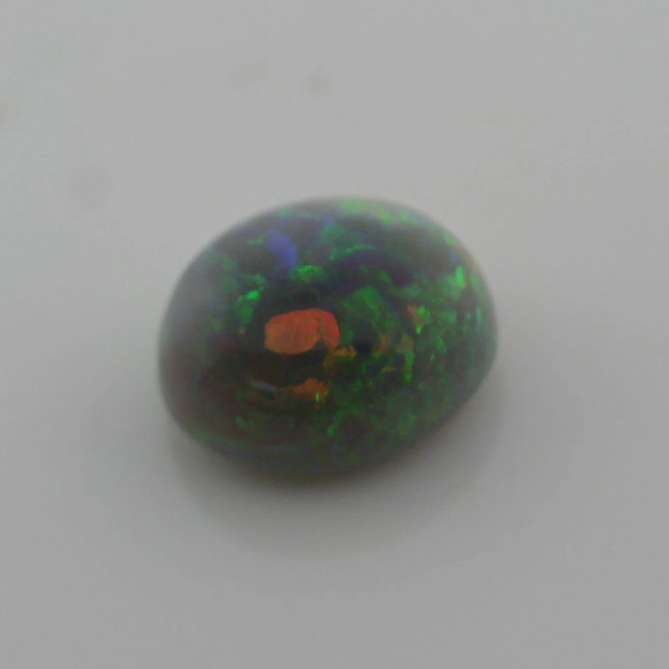 4.67 carat Australian Dark Opal Cabochon Play of Color Green-Orange Blue Tone