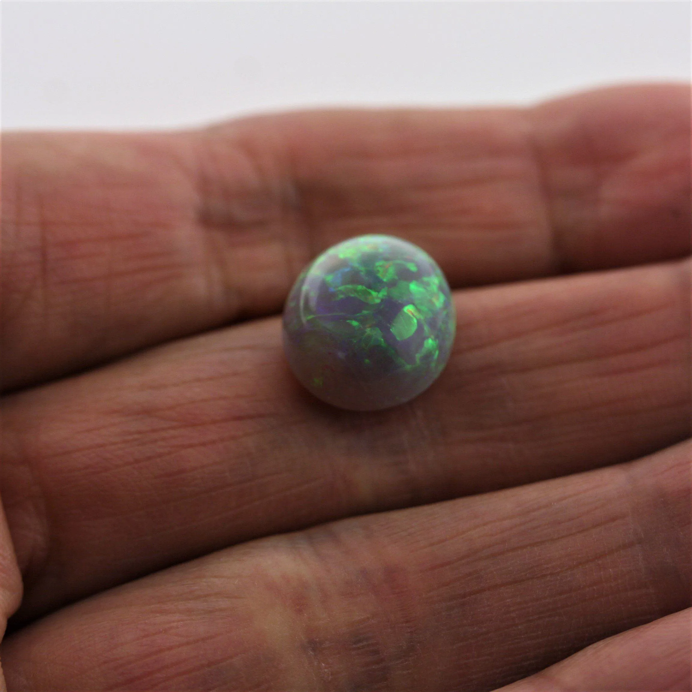 4.67 carat Australian Dark Opal Cabochon Play of Color Green-Orange Blue Tone