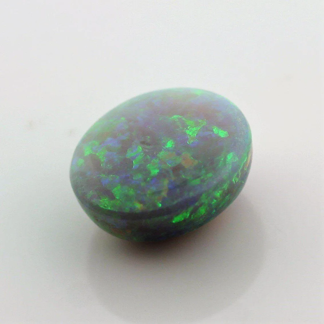 4.67 carat Australian Dark Opal Cabochon Play of Color Green-Orange Blue Tone