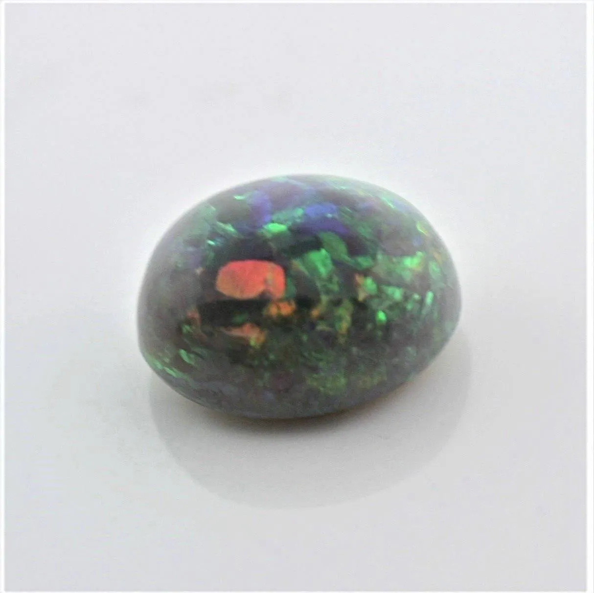 4.67 carat Australian Dark Opal Cabochon Play of Color Green-Orange Blue Tone