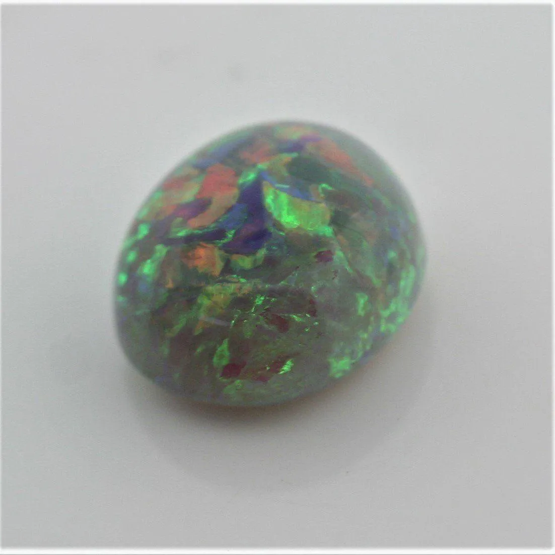 4.67 carat Australian Dark Opal Cabochon Play of Color Green-Orange Blue Tone